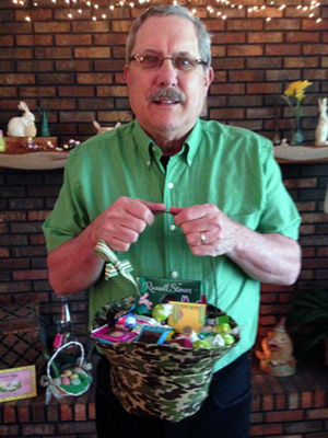 Daddy holds his Easter basket, appropriately covered in camouflage fabric.